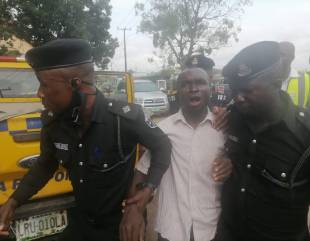 Man attempts jumping down from a mast in Iyana Ipaja Lagos