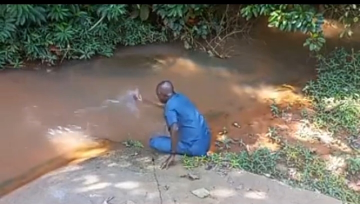 Man Prays Against Evil Nigerian Leaders, Takes Case To His Village Stream (Video)