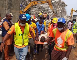 Photos and Video of Two Male Adults Rescued From the Scene of Ikoyi Building Collapse This Morning