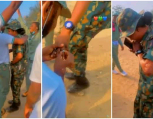 Watch lovely moment NYSC corper proposed to female soldier in camp, Nigerians react.