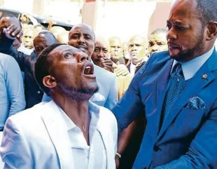 Cleric Carries Out Deliverance By Putting Water Into His Mouth And Spitting It On His Members (Video)