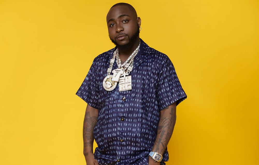 Davido flaunts newly acquired diamond teeth and Timeless gold necklace