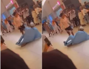 An Ibadan mall proposal results in a man falling to the ground after being smacked by his girlfriend (video)