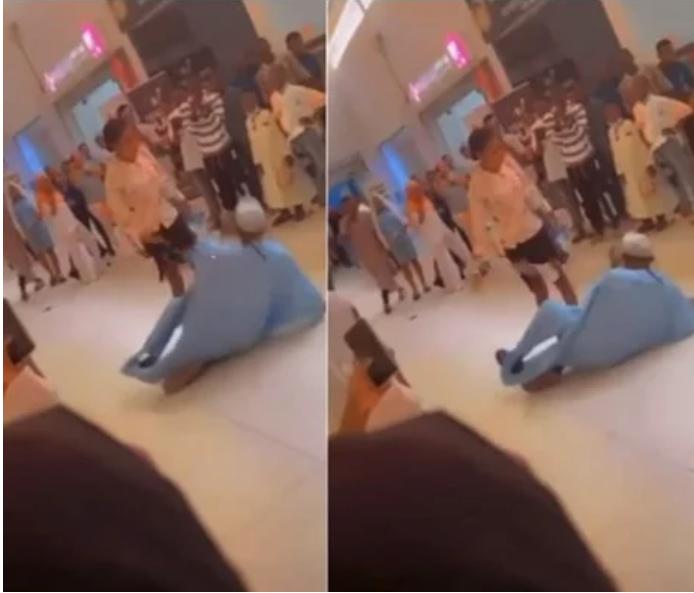 An Ibadan mall proposal results in a man falling to the ground after being smacked by his girlfriend (video)