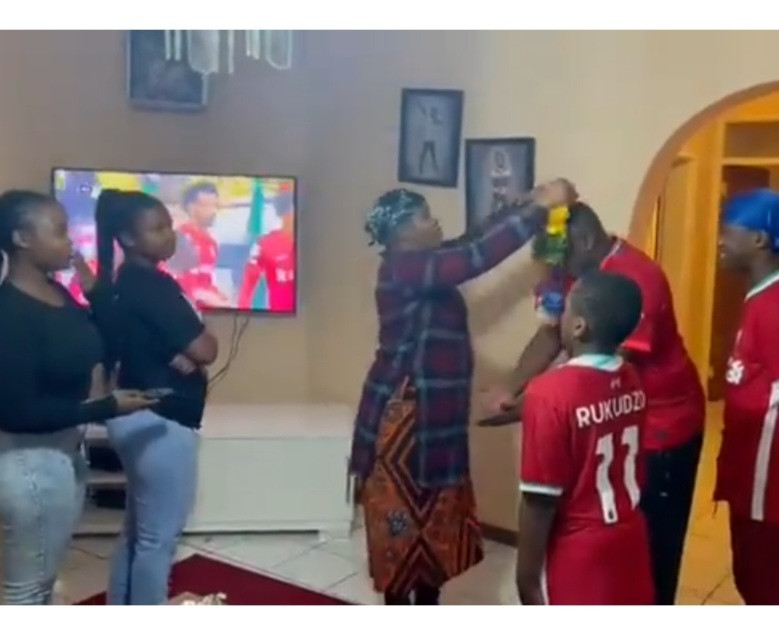 Watch as Family holds hand over ceremony with the women submitting the TV remote control to the men as the Premier League season starts (video)