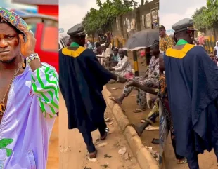 Reactions as Portable hits the streets wearing Agbada, shares money to roadside beggars (Video)