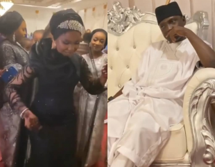 Groom lost in thought as his bride shows off her dance skill at their wedding reception (video)