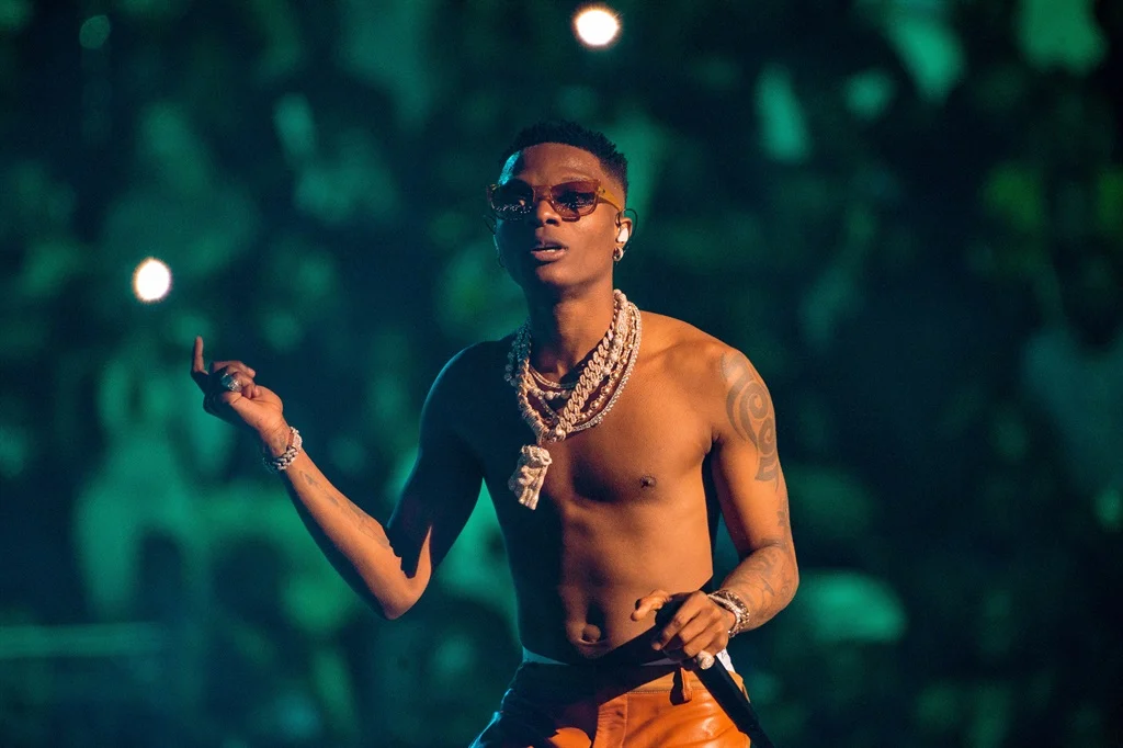 Fans Engage in Intense Battle for Wizkid’s Shirt at UK Concert – Watch Video