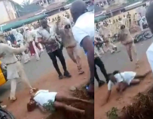 Anger Erupts as Masquerades Brutally Beat Female Nurse Until She Falls in a Gutter in Enugu (Video)